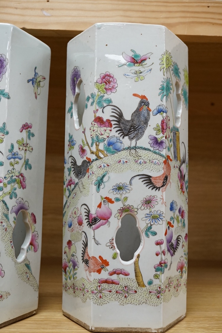 A pair of hexagonal Chinese famille rose porcelain hat stands, 30cm high